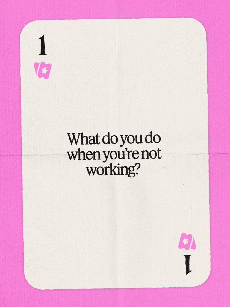 White playing card with a conversation prompt on a bright pink background