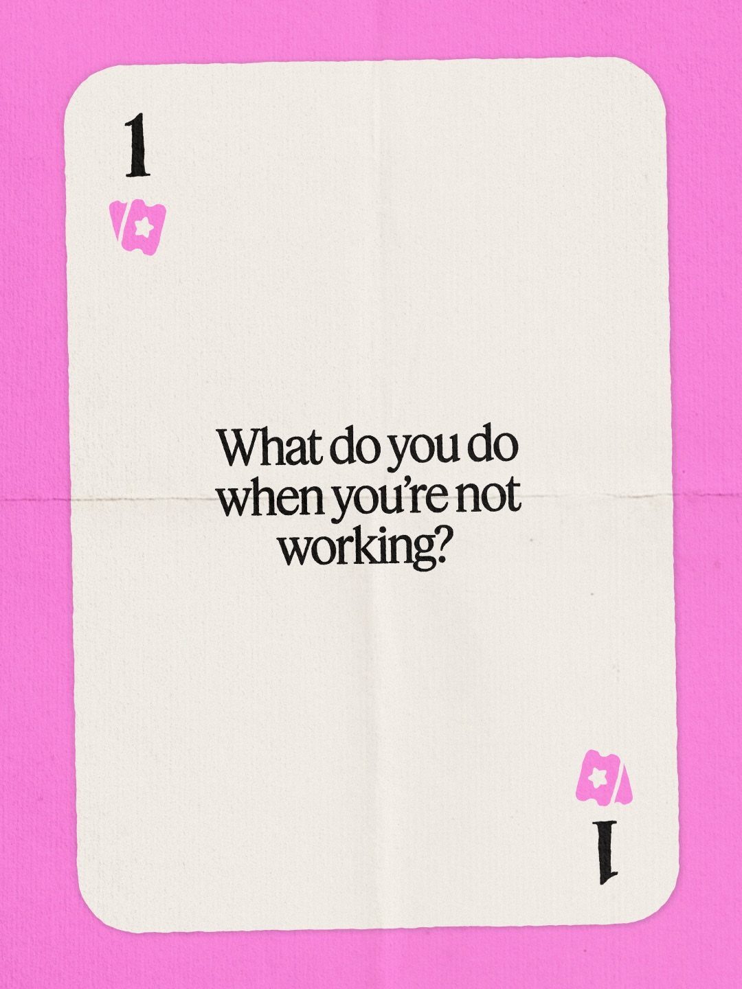 White playing card with a conversation prompt on a bright pink background