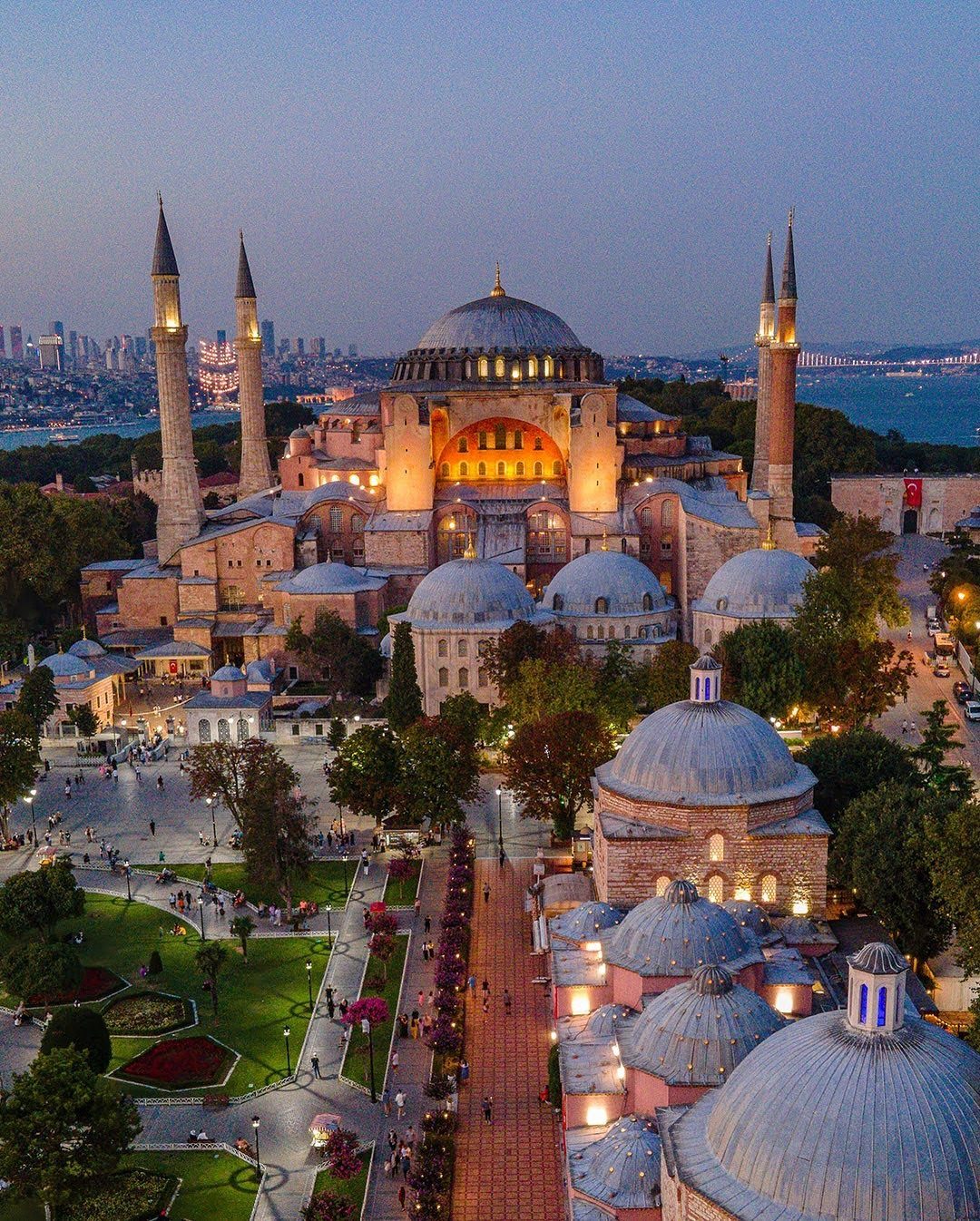 Hagia Sophia mosque with its large dome and minarets during a blue hour evening.